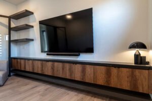 Floating office accent cabinet with Dekton Kelya top.